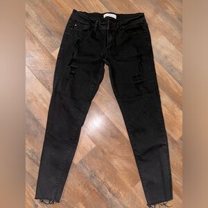 Kancan low rise black skinnies with distressing on the upper legs size 11/29
